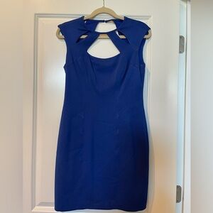 Royal blue body-con dress with cutouts.